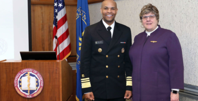 Surgeon General and Vice Admiral Jerome M. Adams with NLM Director Patricia Flatley Brennan, R.N., Ph.D.
